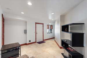 Entryway featuring baseboards and recessed lighting