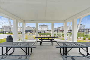Exterior space with a residential view and fence