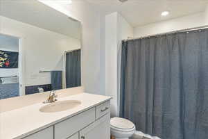 Full bathroom featuring vanity and toilet