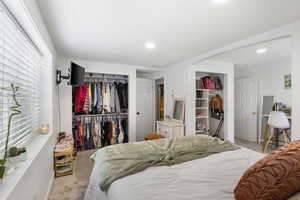 Carpeted bedroom featuring recessed lighting, a closet, and baseboards