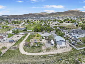 Drone / aerial view featuring a mountain view and a residential view