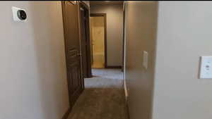 Hall featuring carpet floors