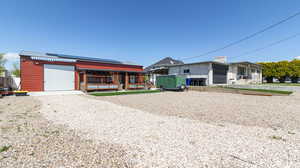 View of front of property featuring roof mounted solar panels