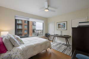 Bedroom featuring wood finished floors and a ceiling fan