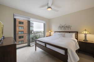 Bedroom with light colored carpet and ceiling fan