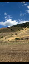 Property view of mountains with a rural view