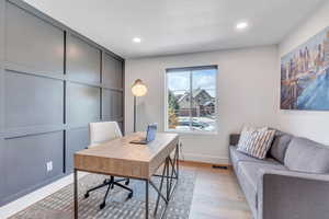 Office area with recessed lighting, baseboards, visible vents, and light wood-type flooring