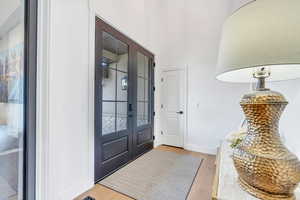 Foyer featuring wood finished floors and baseboards