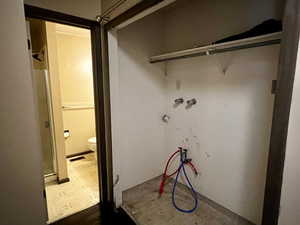 Laundry area with tile patterned floors and visible vents