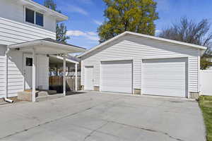 Detached garage featuring fence
