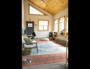 Living area with wood ceiling and high vaulted ceiling Sun Room !