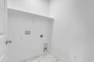 Clothes washing area featuring electric dryer hookup, marble finish floor, baseboards, laundry area, and washer hookup