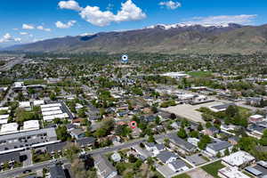 Birds eye view of property with a residential view and a mountain view