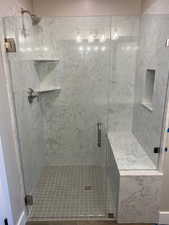 Full bathroom with a stall shower