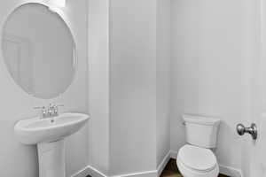 Bathroom with baseboards and toilet