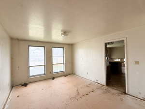 Empty room with a textured ceiling