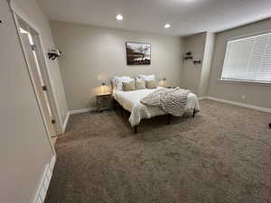 Bedroom featuring recessed lighting, carpet, and baseboards