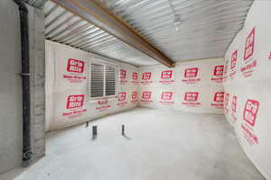 Empty room with unfinished concrete floors