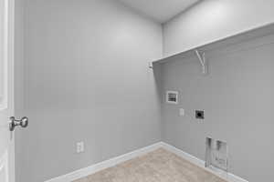 Washroom featuring baseboards, laundry area, washer hookup, and hookup for an electric dryer