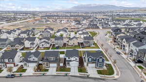 Birds eye view of property with a mountain view and a residential view
