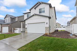 View of front of home with central AC unit, concrete driveway, stone siding, an attached garage, and fence