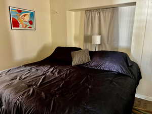 Bedroom with wood finished floors