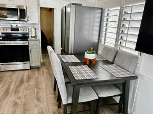 Dining space with light wood-style flooring