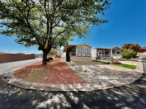 View of front of home with driveway and covered porch