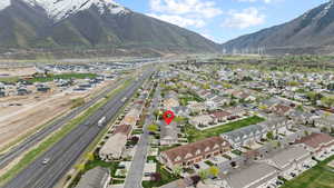 Birds eye view of property with a residential view and a mountain view