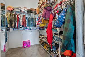 Walk in closet with carpet