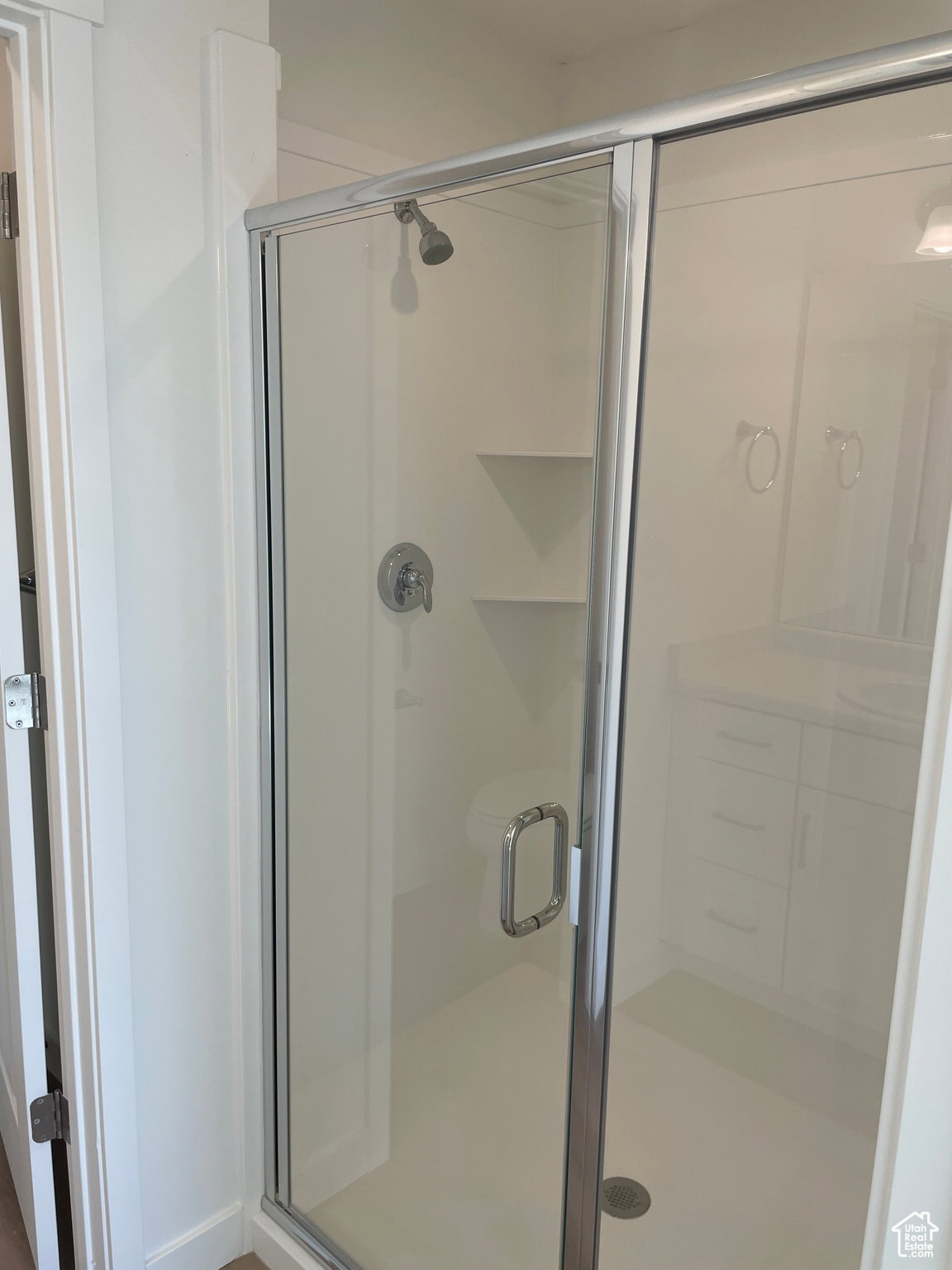 Bathroom featuring a shower stall