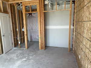 Misc room featuring concrete flooring