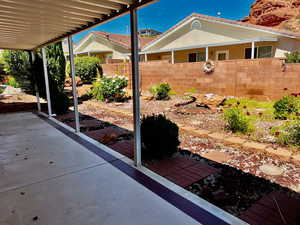 View of patio with fence