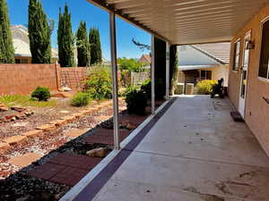 View of patio with fence