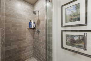Bathroom featuring tiled shower