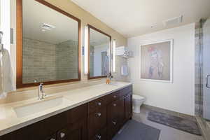Bathroom with tile patterned flooring and double vanity