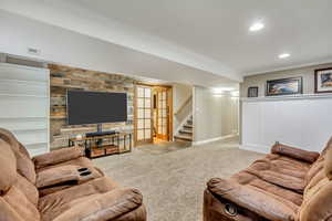 Living area with visible vents, recessed lighting, carpet, stairs, and crown molding