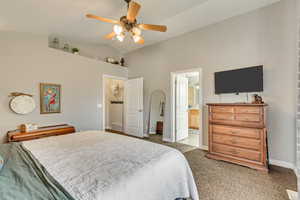 Bedroom with high vaulted ceiling, a ceiling fan, baseboards, carpet flooring, and visible vents
