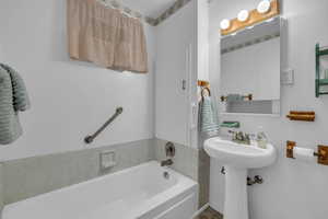 Full bathroom featuring a garden tub.  Used as a master bathroom.