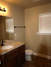 Main bathroom featuring with window and oil rubbed bronze faucet.