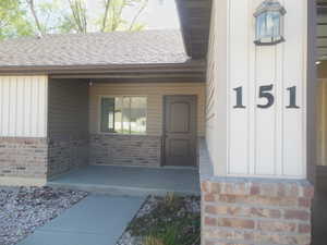 View of entry featuring a covered porch.