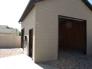20x20 detached garage with 12 foot ceilings, 10x10 door, 8x7 door, a man-door and 220 volt 50 amp power.