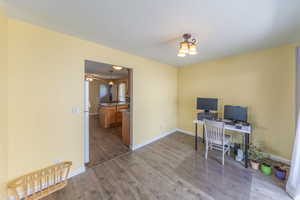 Formal dining room, large windows, easy access to kitchen,  wood finished floors.