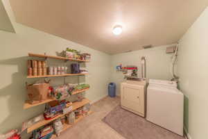 Laundry room & additonal storage. Lots of space to keep and sort clothing as well as other storage items.