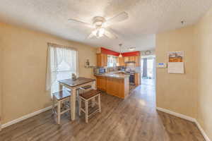 Kitchen featuring a peninsula, and semi-formal dining area