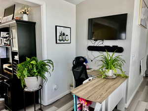 Office featuring baseboards and wood finished floors