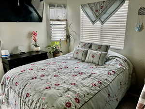 Bedroom featuring a textured wall