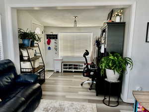 Home office with wood finished floors and baseboards
