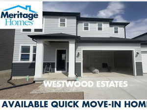Exterior space featuring an attached garage and concrete driveway
