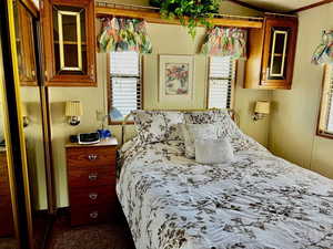 Bedroom featuring multiple windows